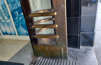 The bronze clad entrance doors before the restoration at Richmond station - South Western Railway