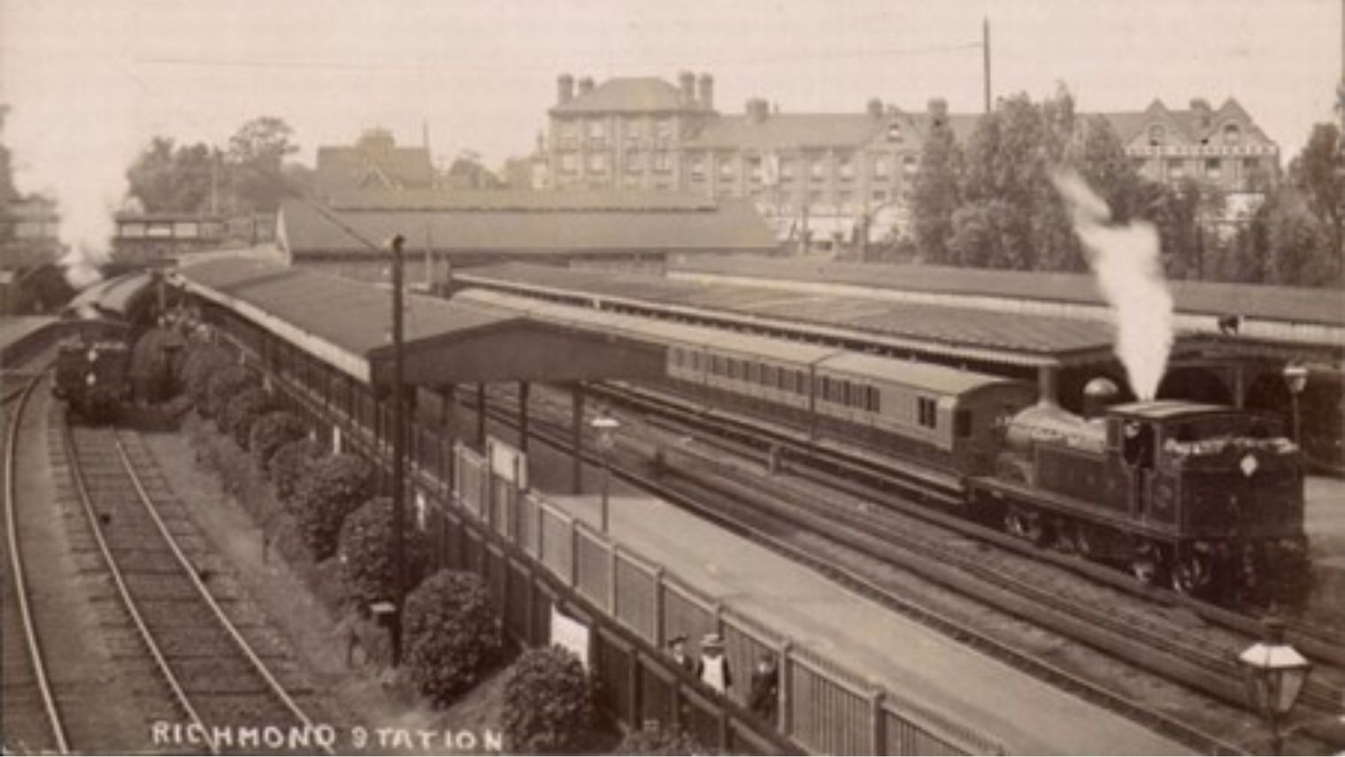Archive postcard of the original Richmond station looking West towards the station buildings