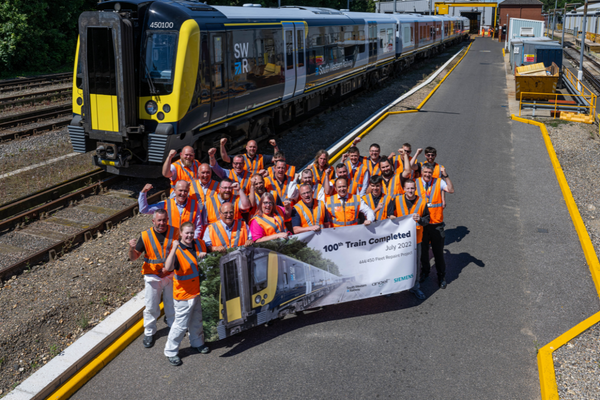  450100 Desiro at Bournemouth Depot with group of people in hi-vis vests