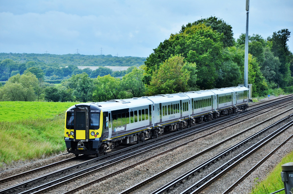 Class 444 train travelling through the countryside