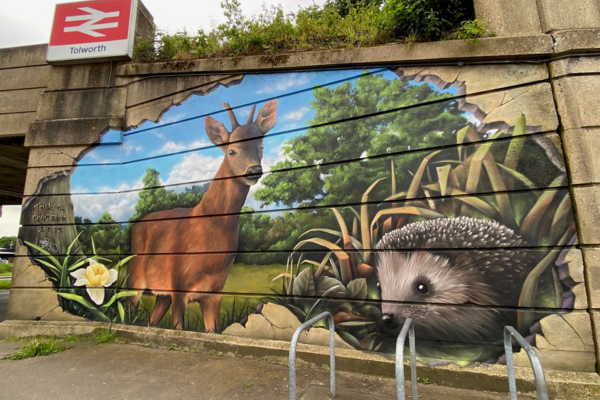 Tolworth station mural of a deer and a hedgehog