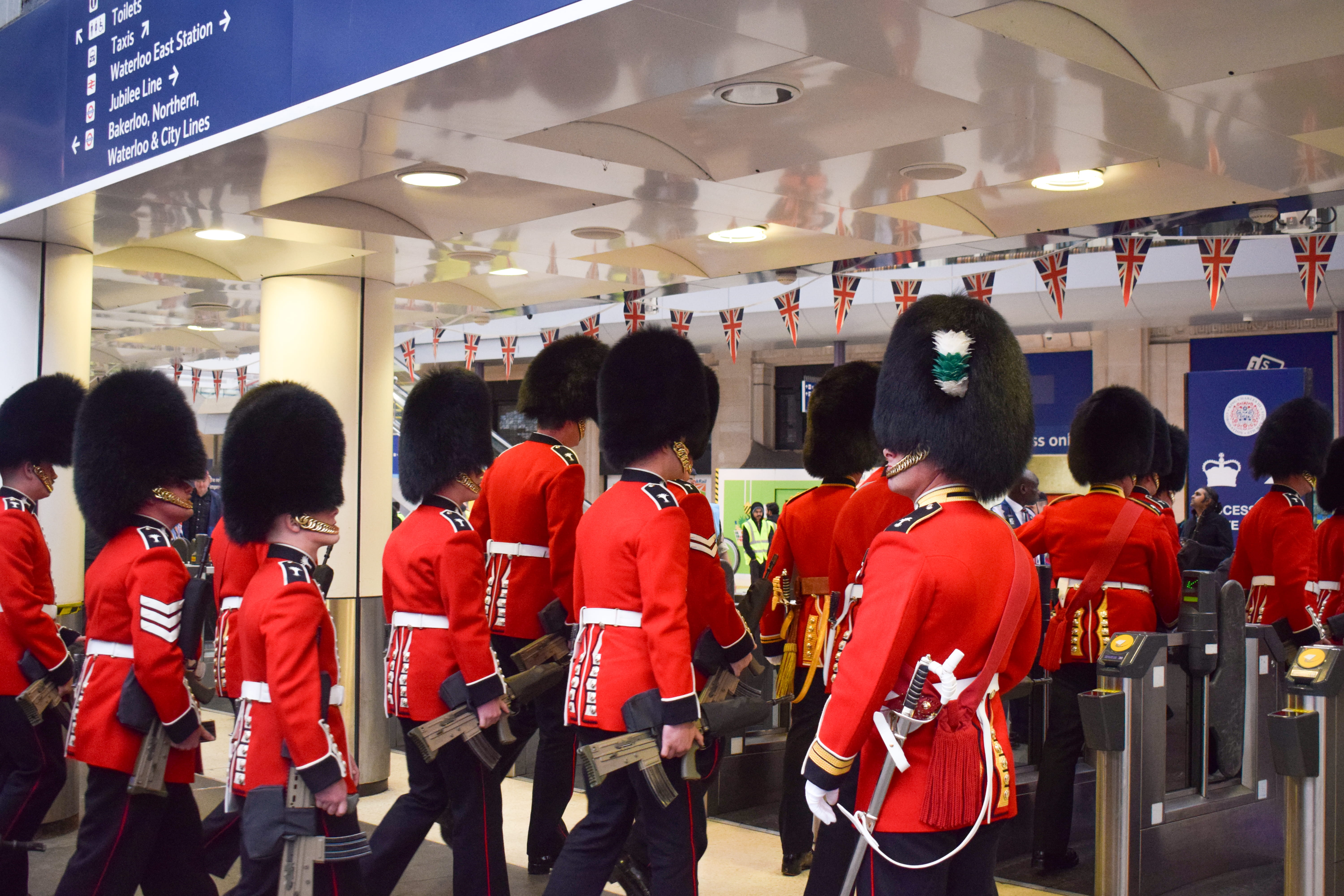 Soldiers from a Guards regiment passing through the gateline at Waterloo