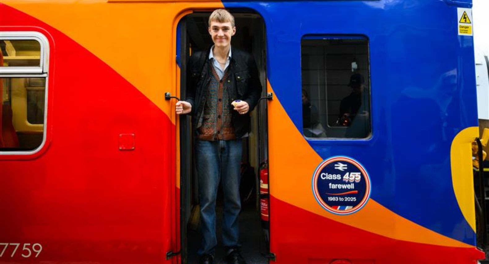 Francis Bourgeois standing in the driver's cab doorway of a Class 455 train