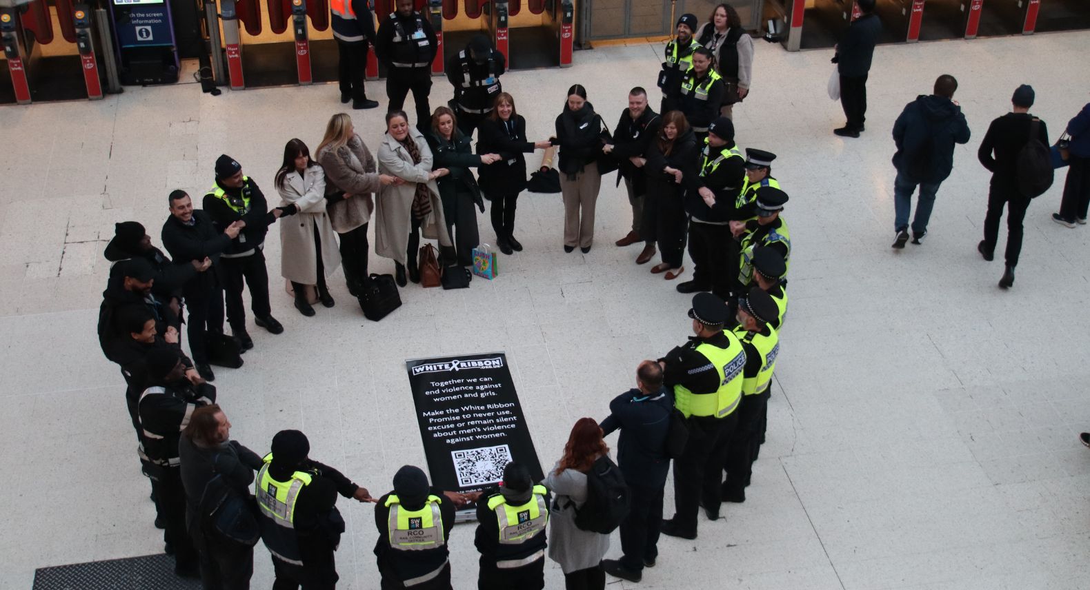 Human chain for White Ribbon Day seen from above