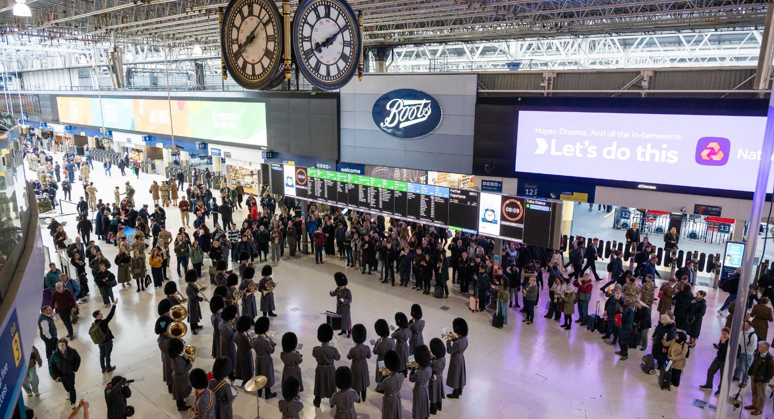 A band of and of Grenadier Guards from above at London Waterloo