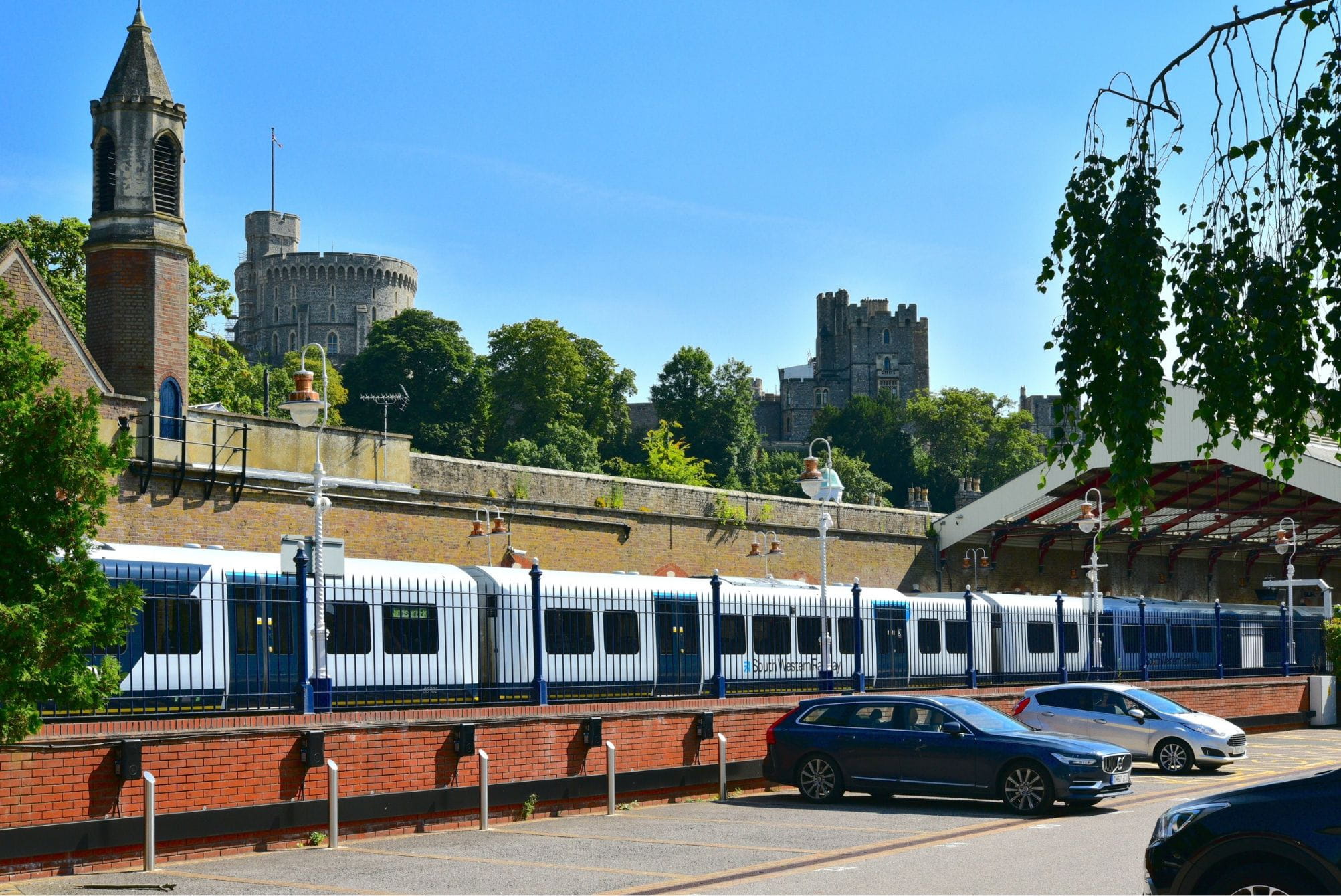 Windsor Riverside station with Windsor Castle in the background and a South Western Railway train