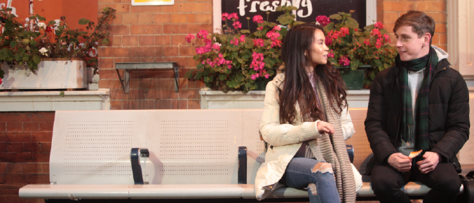 2 people sit in the bench