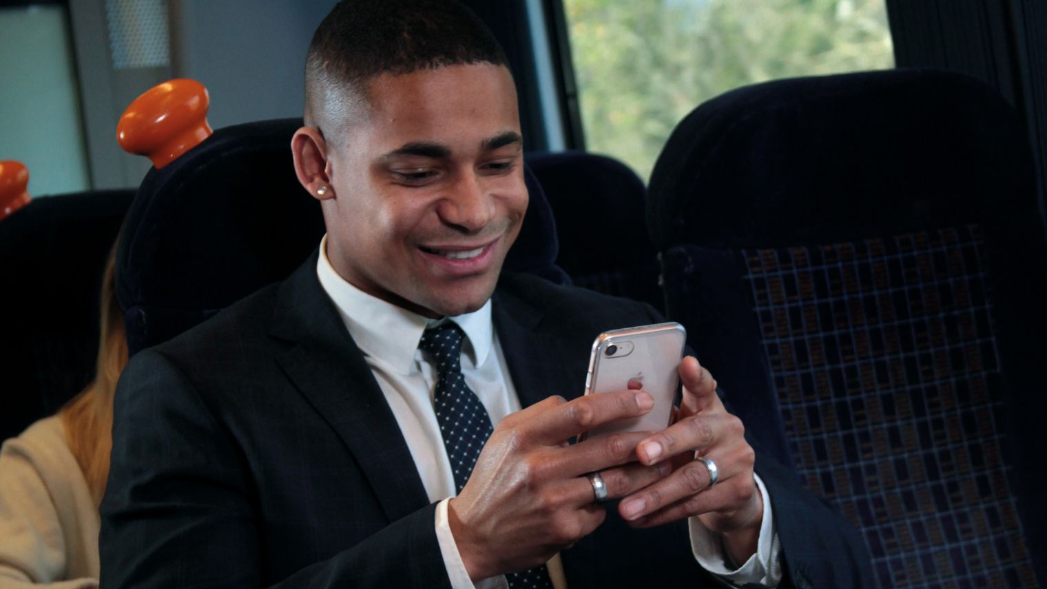 Person on phone on the train