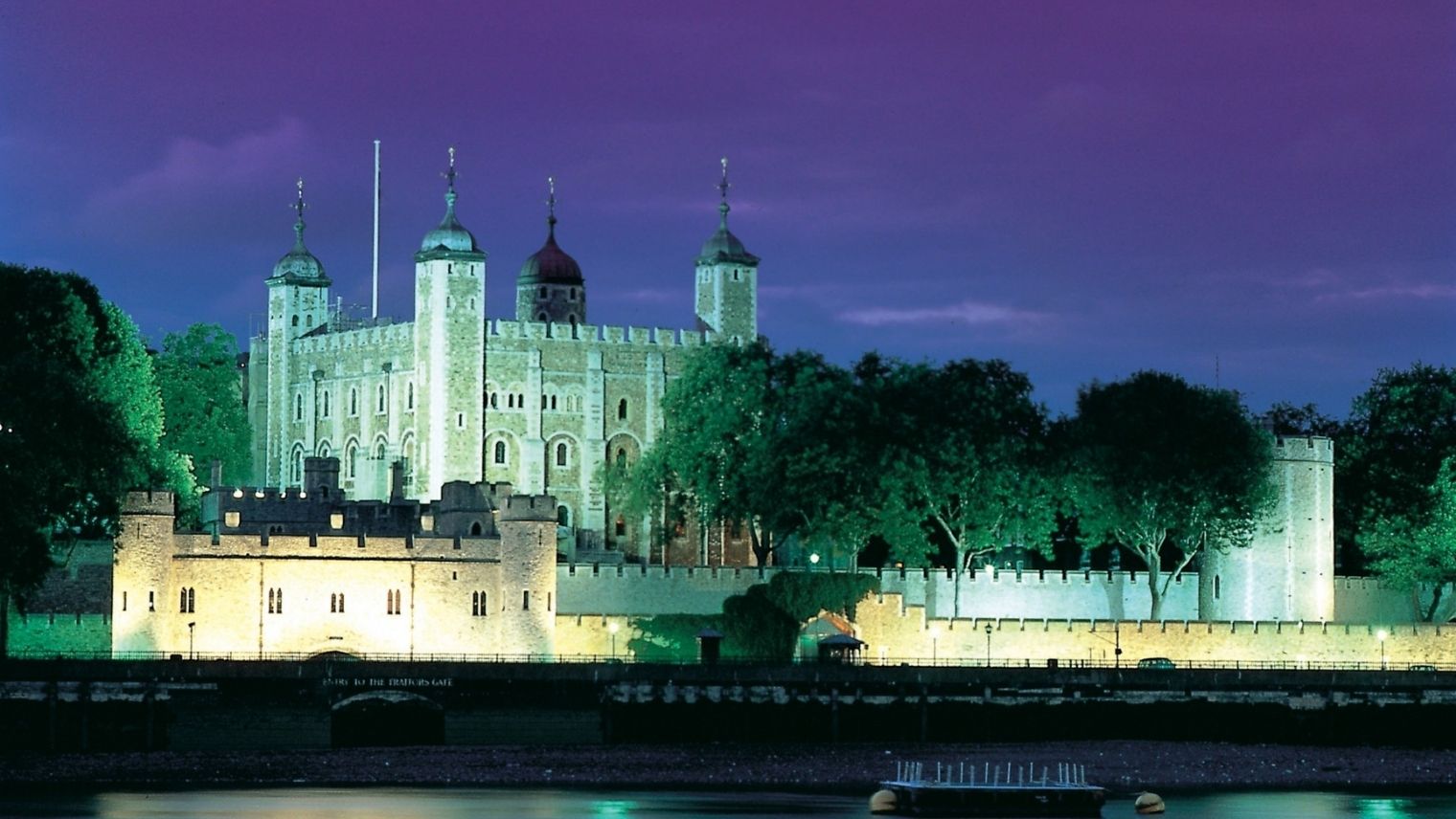The Tower of London at night, seen from the south bank of the Thames