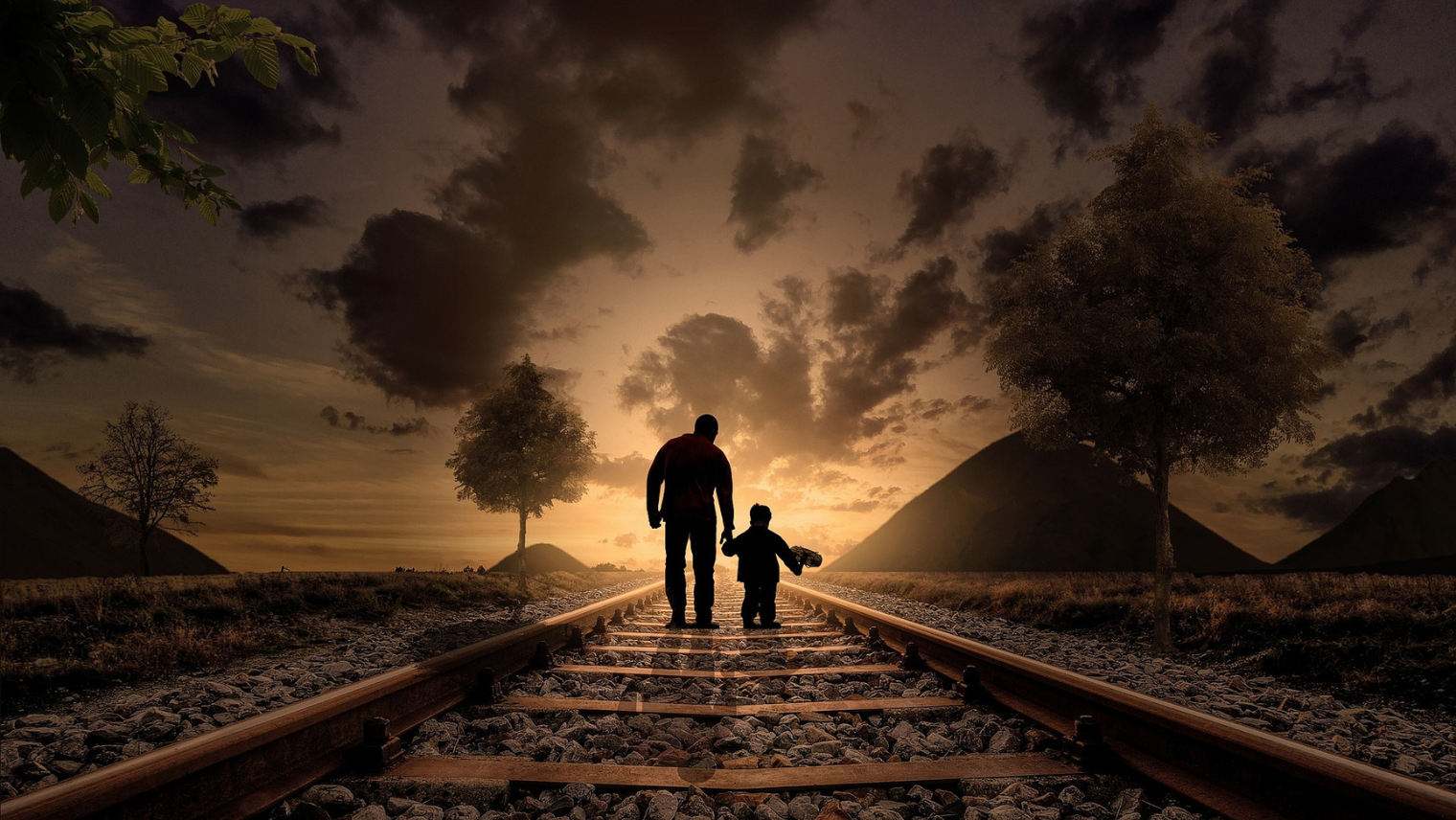 father and son on an abandoned railway track