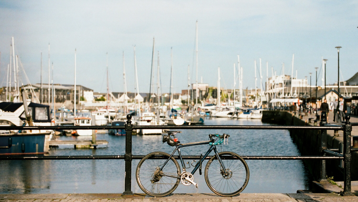 Image of a bike against a rail on Plymouth Pier
