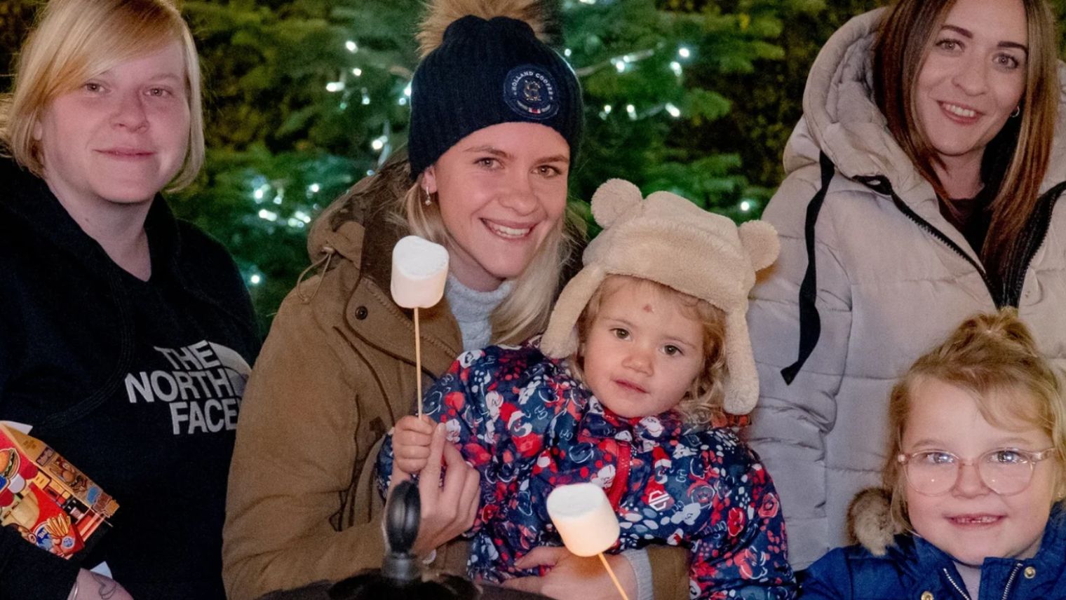 A family holding marshmallows