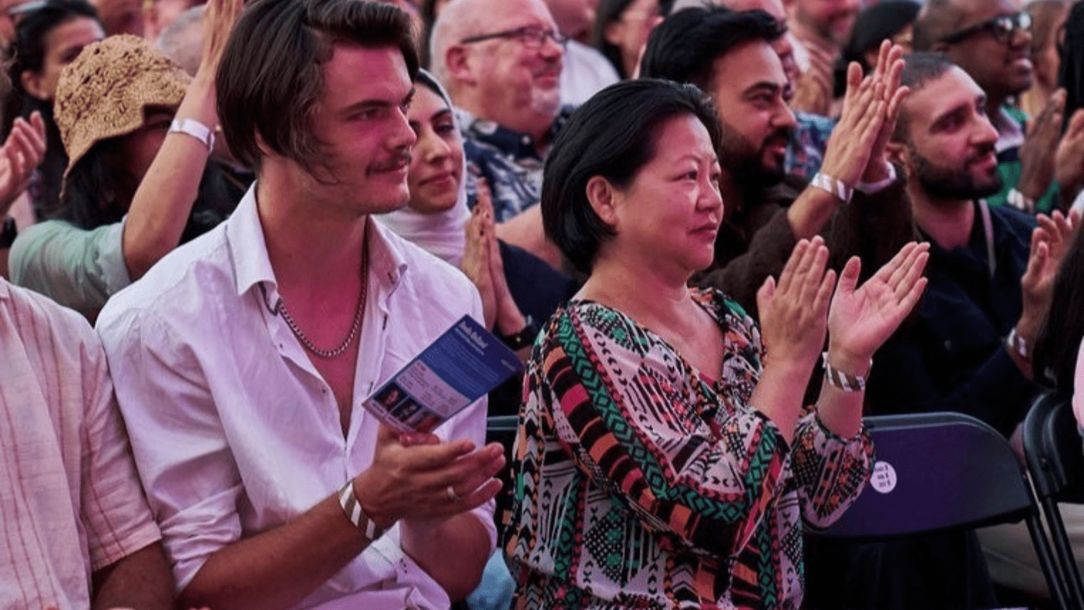 Festival audience clapping during comedy show