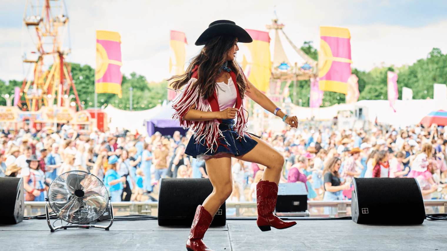 Country dancer performing on stage at festival