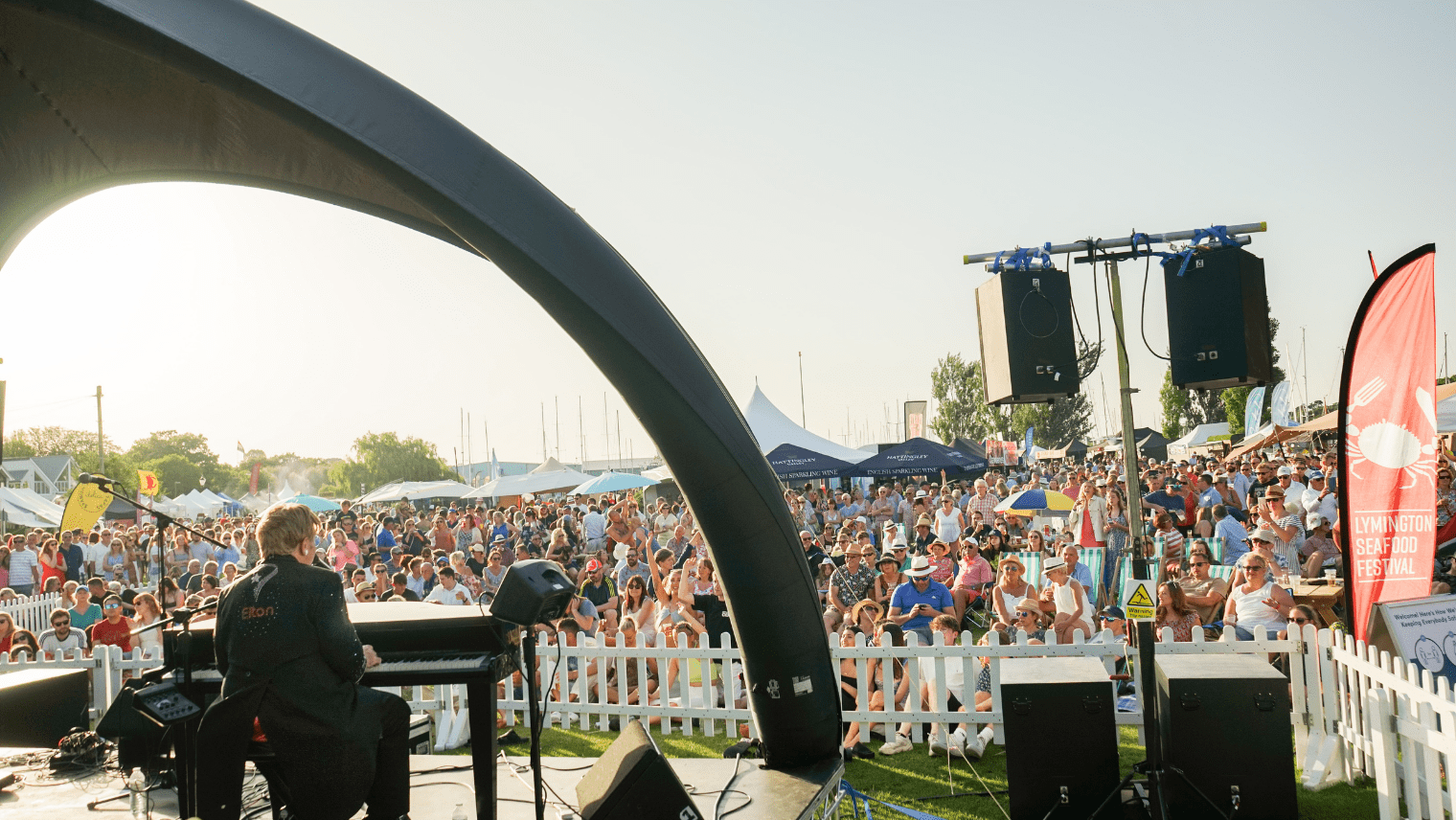 Crowd watching live music at Lymington Seafood Festival 