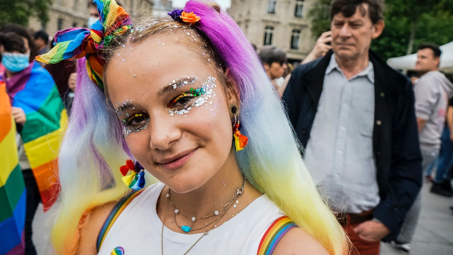 Image of a girl smiling at a Pride event