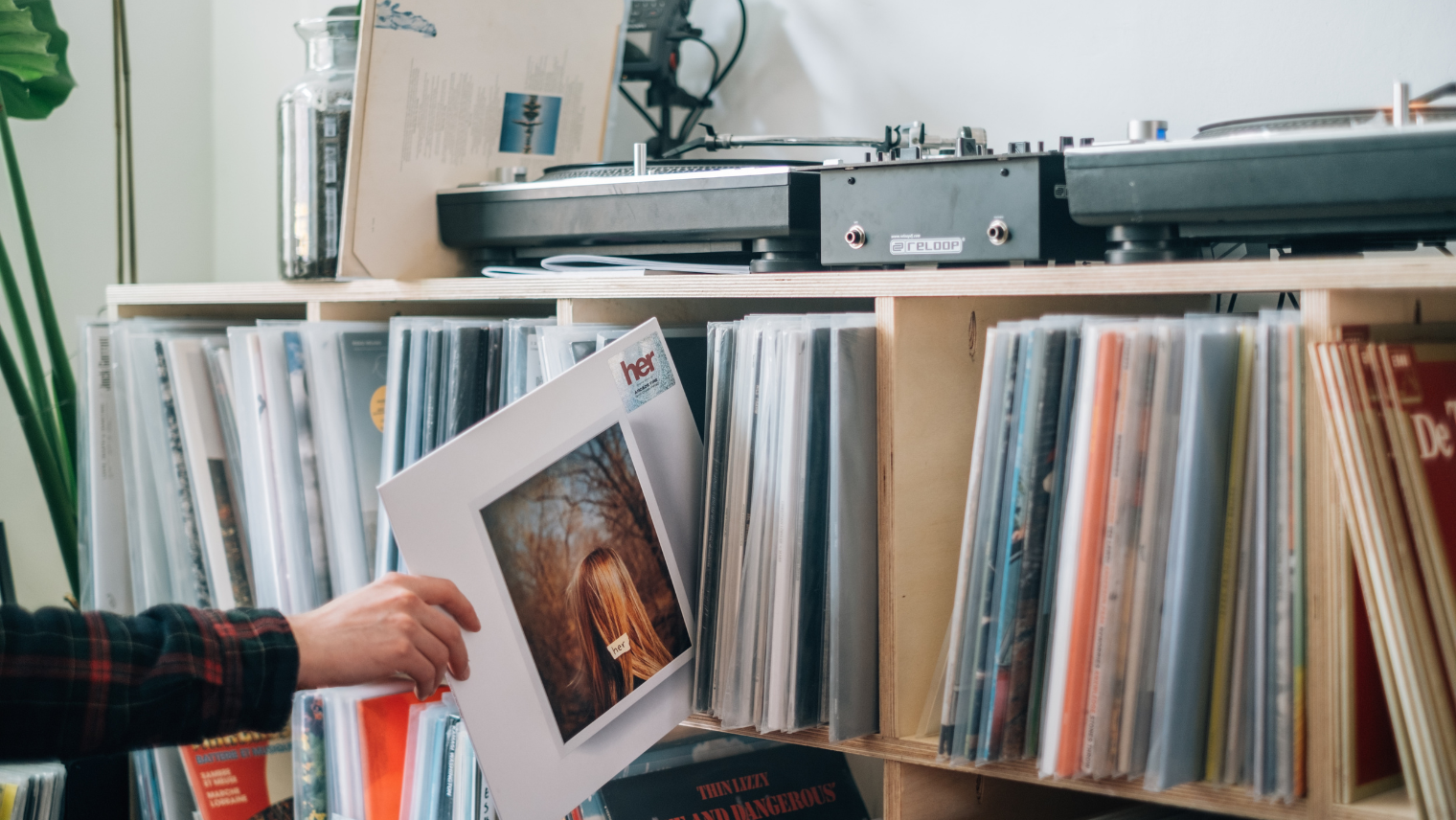 Image of someone picking out a record from their collection