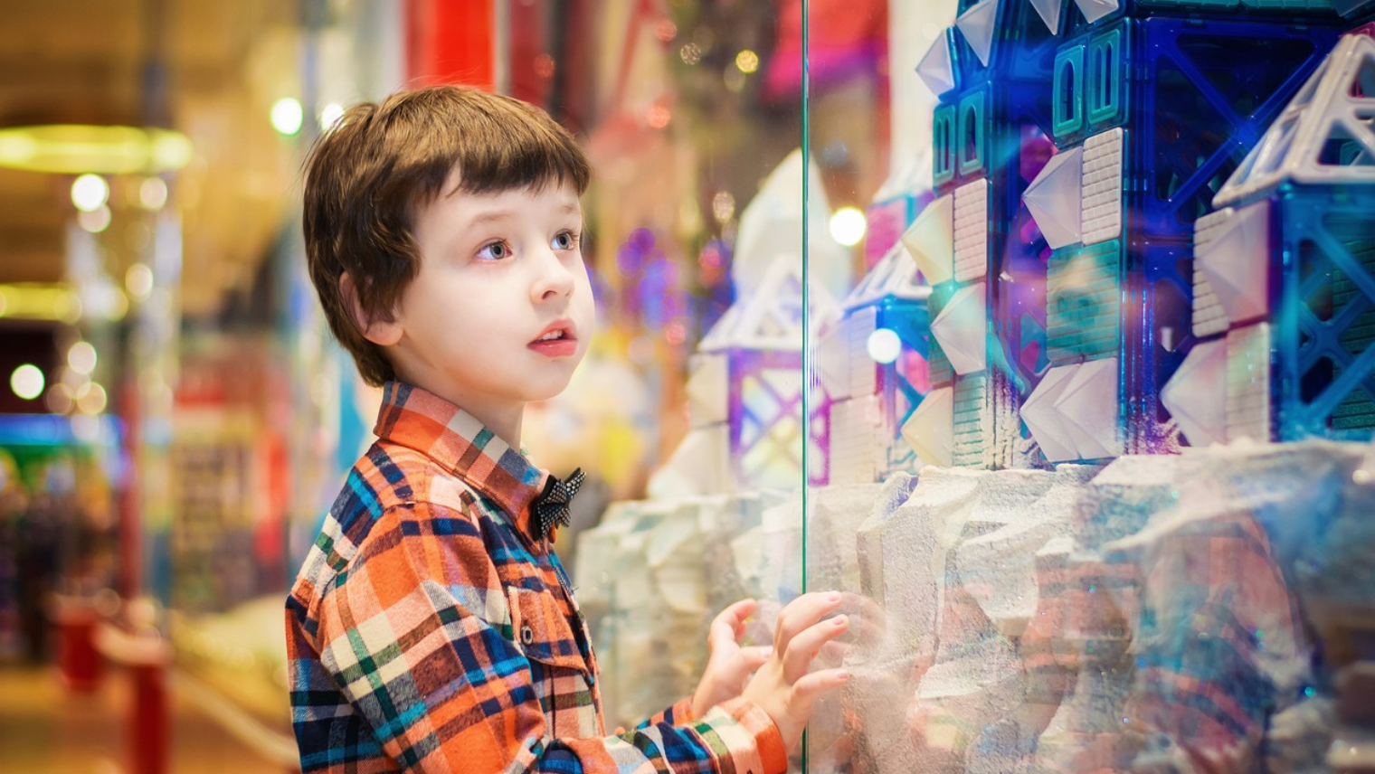 Child looking at a shop window