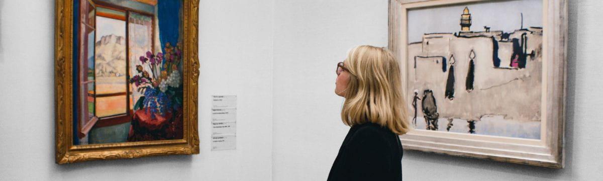 Woman looking at painting