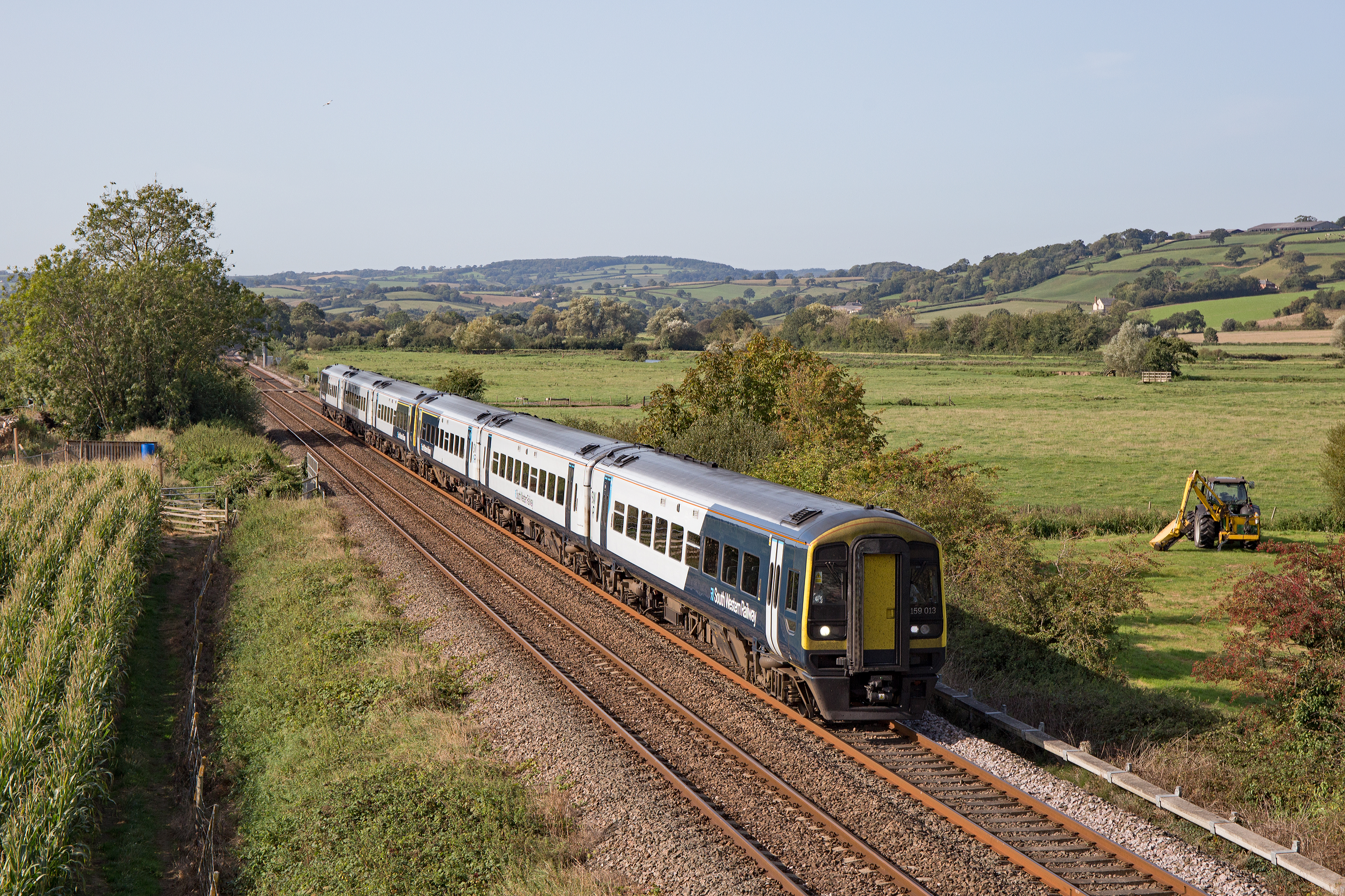 159 class train travelling through countryside