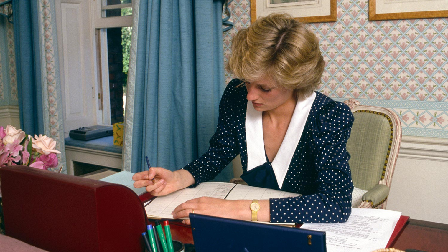 Image of Diana, Princess of Wales at work at a desk