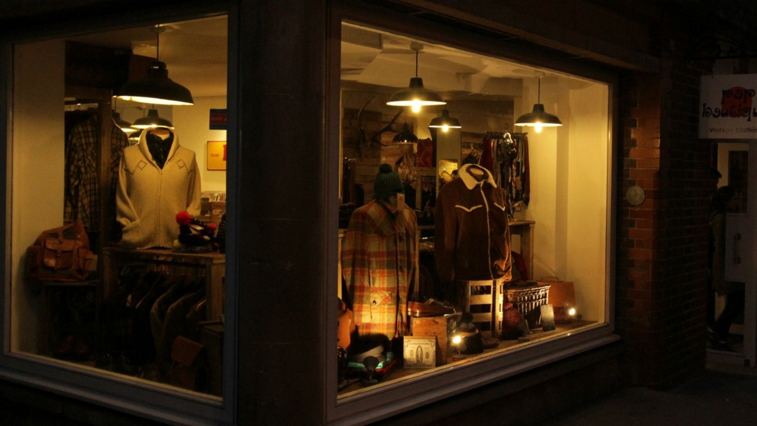 Shopfront of Pop Boutique vintage store at night