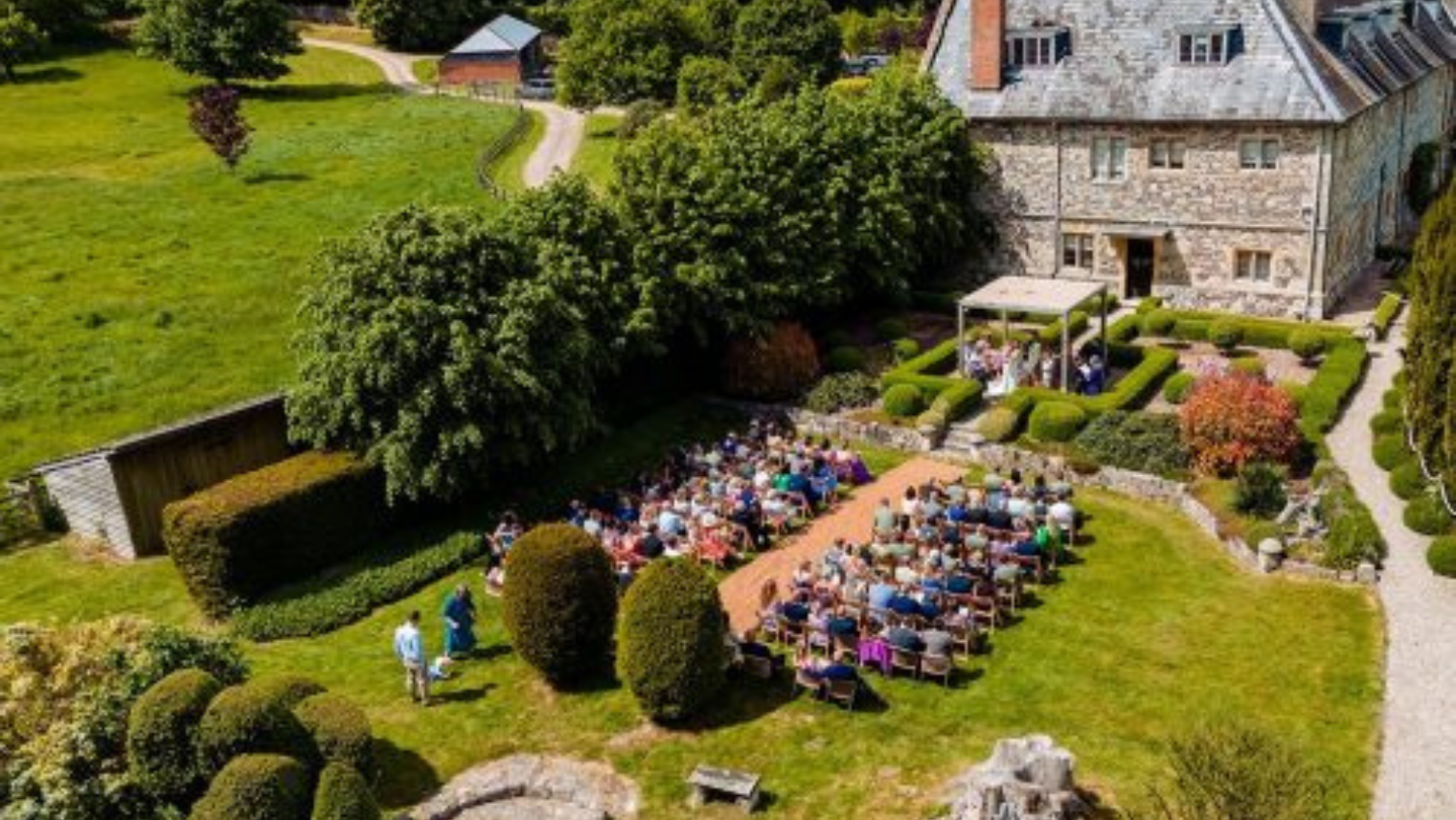Image of an outdoor wedding ceremony at Manor Estate