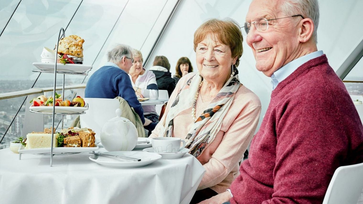 A couple enjoying afternoon tea at the Spinnaker Tower