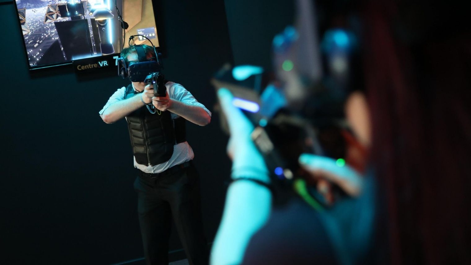 Users playing with VR equipment at CentreVR, Bournemouth