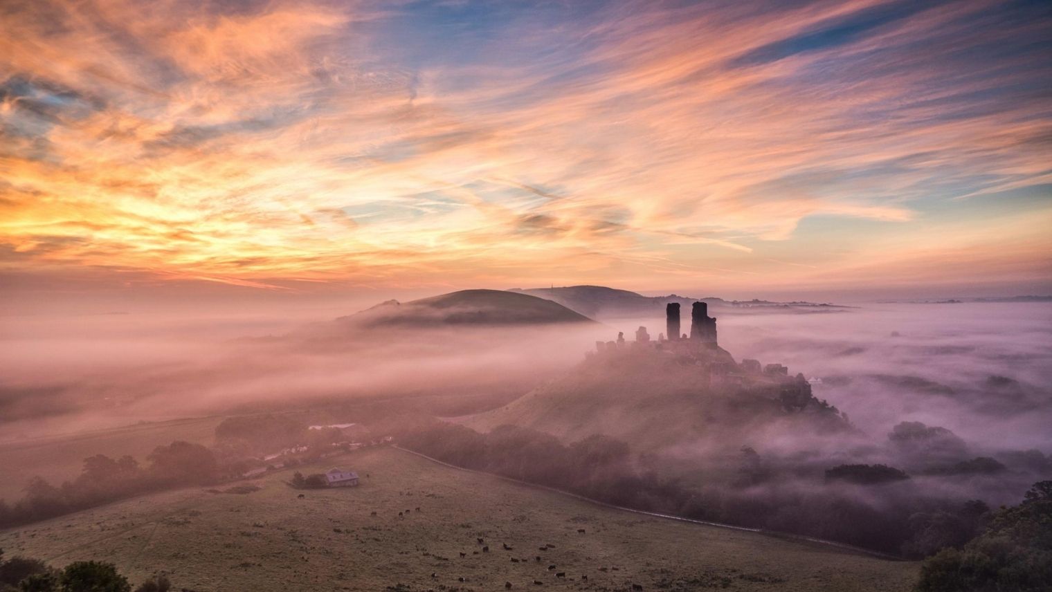 View of Corfe Castle at sunrise