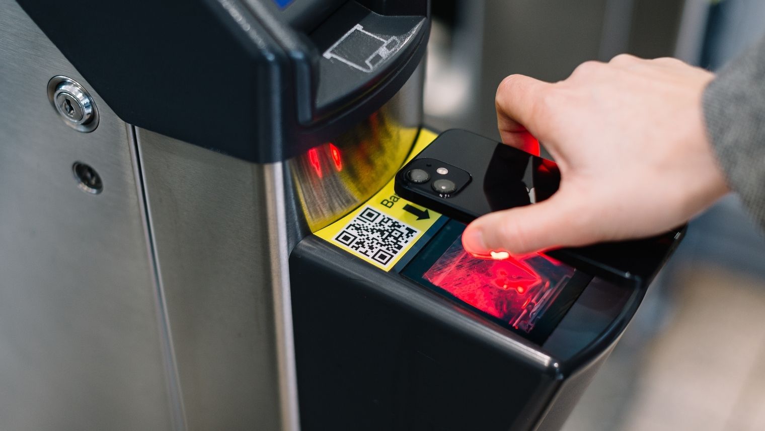 A person scanning train e-tickets using their phone